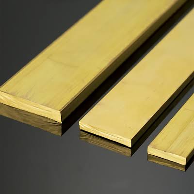 Hands holding small green plant seedling with soil and blurred green background